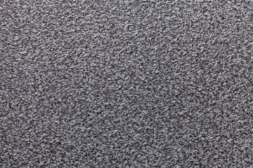 Grainy gray background with spotted pattern. Texture backdrop