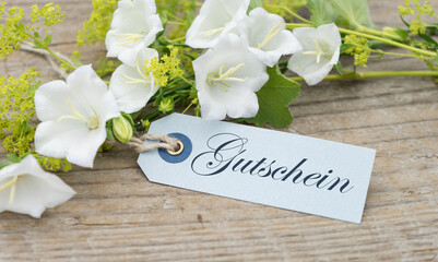 white bell flowers and german text gift card