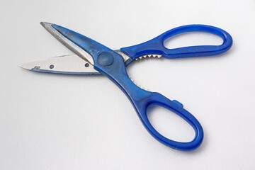 Old household scissors on a white background close-up