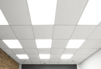 White ceiling with lighting in office room