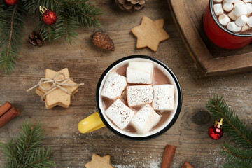 Obraz na płótnie Canvas Flat lay composition with delicious marshmallow cocoa and Christmas decor on wooden table