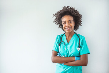 Portrait of a confident doctor working at a hospital. Portrait of a young nurse/doctor. Portrait of female African American doctor standing in her office at clinic. 