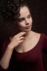Fototapeta premium Charming trendy girl with adorable afro curls made by hot tool