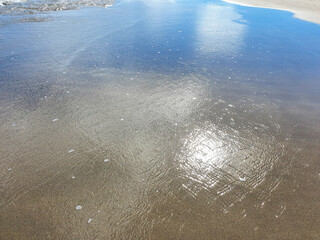 water drops. Tropical beach with yellow sand and blue water. A summer vacation, holiday background of a beach 