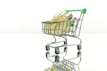 Shopping basket full of glass oil bottles isolated on white background. Concept of shopping