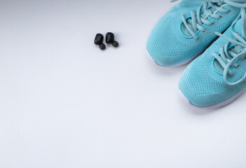 sports shoes, headphones on a white background. top view.