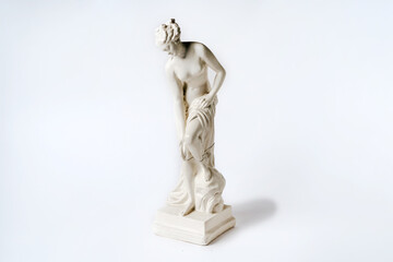 White tabletop ancient statue of a woman on a white isolated background