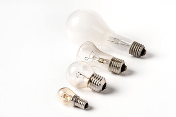 Incandescent lamps of different patterns and sizes on a white background