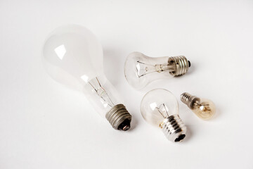 Incandescent lamps of different patterns and sizes on a white background