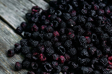 Blackberries on wooden background close up