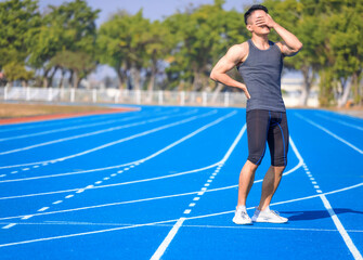 Obraz premium Young fitness man holding his sports injury, muscle painful during training