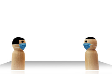 Social Distancing, Couple wooden figure stands distance for infection risk and disease ,wearing a surgical mask for prevent virus Covid-19.Corona virus. Valentine and Health care concept.