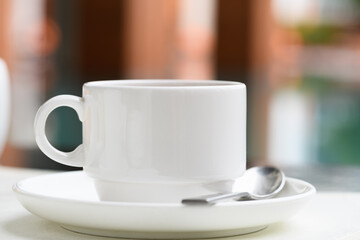 A cup of tea with a spoon