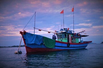 fishing boats at sunset