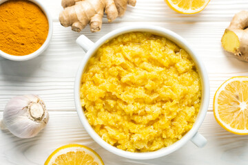 Natural home remedy bowl that will make immune system stronger and powerful with lemon and ginger with garlic