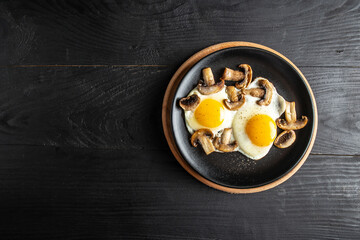 Fototapeta na wymiar Fried egg, mushrooms. Keto, paleo breakfast, Healthy and classic brunch. Top view