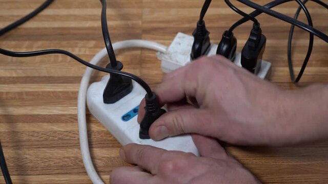 multi socket - plugs of various household appliances attached to the electricity charge - energy saving
