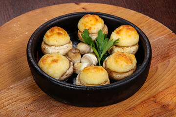 Baked champignon staffed with cheese