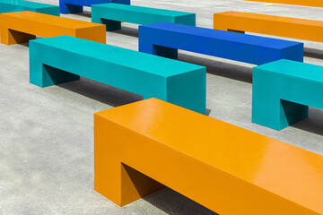 Multicolor benches in the city. Benches made of lumber, plywood. Design solution for a recreation area in the park.Benches made from plywood sheets do-it-yourself (handmade)