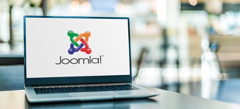 Laptop computer displaying logo of Joomla