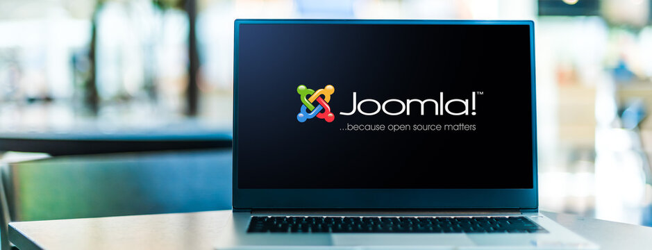 Laptop computer displaying logo of Joomla