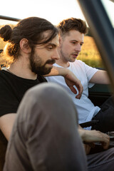 Tired young boys models sitting in the car