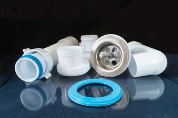 Plastic siphon for sink on black background
