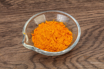 Tumeric powder in the bowl