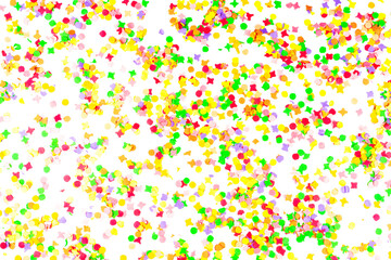 top view of colorful paper confetti isolated on white background