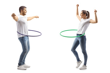 Young man and woman spinning a hula hoops