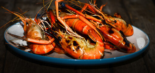 The large, orange-colored prawns are hot-grilled, a delicious seafood dish.