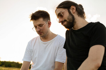Obraz premium European young white men in sunglasses on white