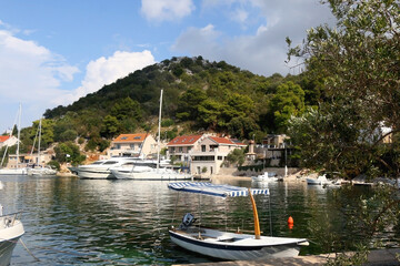 Fototapeta na wymiar Small fishing boat in the picturesque port on island Lastovo, Croatia.
