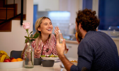 A young happy couple excited to have lunch at home together. Love, relationship, together