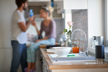 A young couple in love at the kitchen. Cooking, home, kitchen, relationship