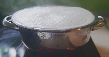 Steam or vapor clouds rising from boiling water