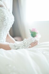 the bride holding the groom's corsage