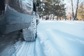 Car tires on winter road