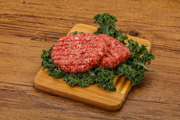 Raw beef burger cutlet for cooking