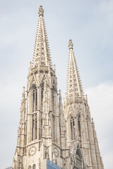 Bell towers of Votive Church in the historical and touristic downtown in Vienna, Austria.