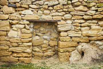 Background texture of a stone wall photo. Natural stone wall texture for the background. Old brick texture