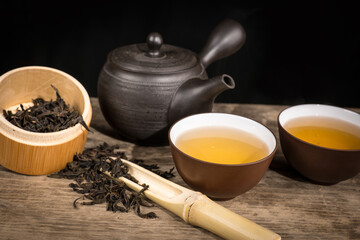 preparation of green loose tea in traditional Japanese ceramics