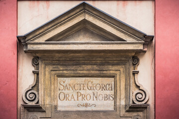 Inscription Sancte Georgi Ora pro Nobis above the Entrance to Saint Georges Basilica in Prague