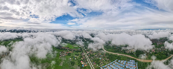 Aerial drone view of Lampang city Thailand, The mist of the rainy season in the morning, The form of banners for the concept