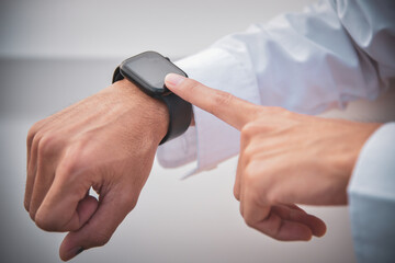 black smart watch on the business man's wrist