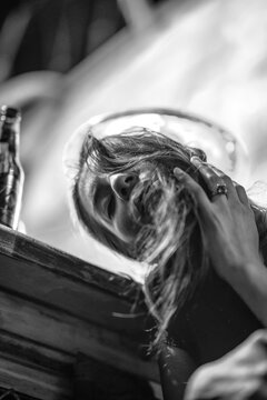 Black and white slim fit girl looking down from light above