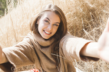 Closeup portrait of young beautiful woman outdoors. Attractive young female on neutral background.