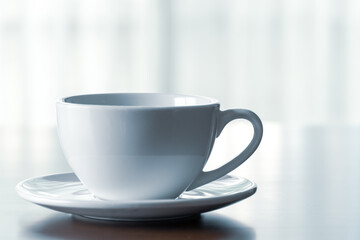 Close up of coffee cup on wooden table at home in holidays.