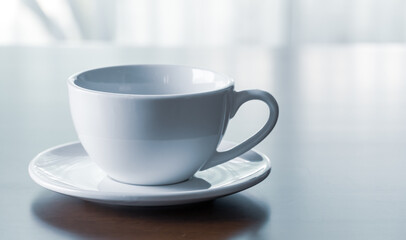 Close up of coffee cup on wooden table at home in holidays.