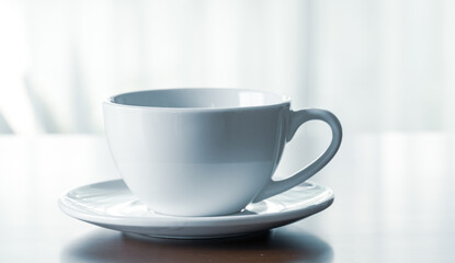Close up of coffee cup on wooden table at home in holidays.